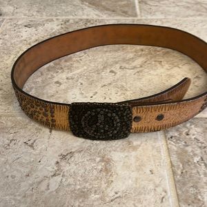 Gold studded Ariat belt with peace sign buckle